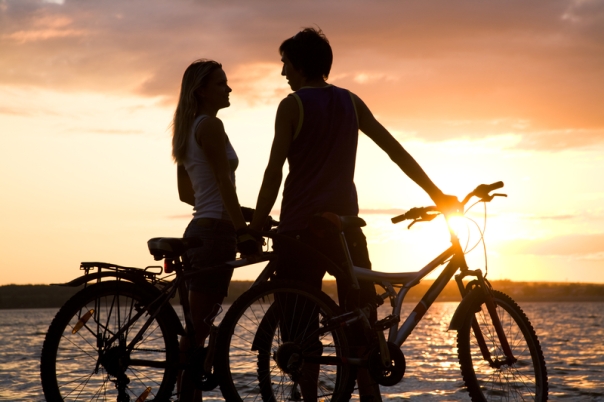 Couple-biking-at-sunset.jpg